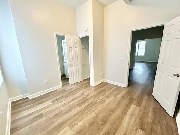 a view of a room with wooden floor and stairs