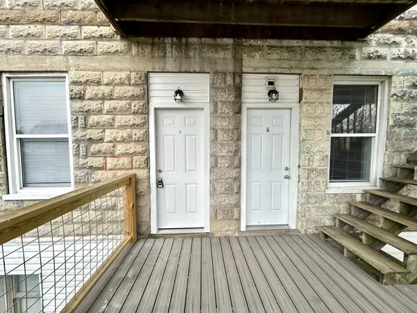 a view of a wooden door of the house