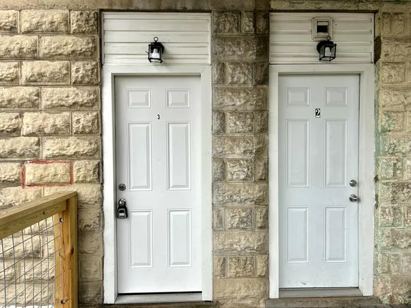 an entrance to house with yard and wooden floor