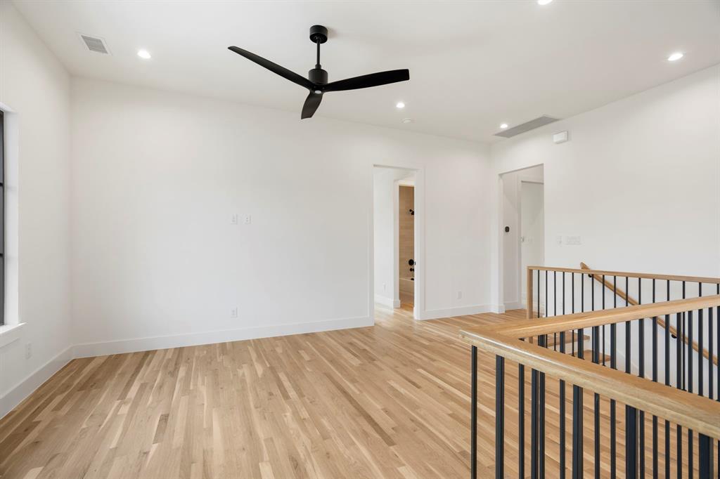 3316 Ferguson Road Grapevine, TX 76092 - Photo 23 of 39 a view of a room with wooden floor and a ceiling fan