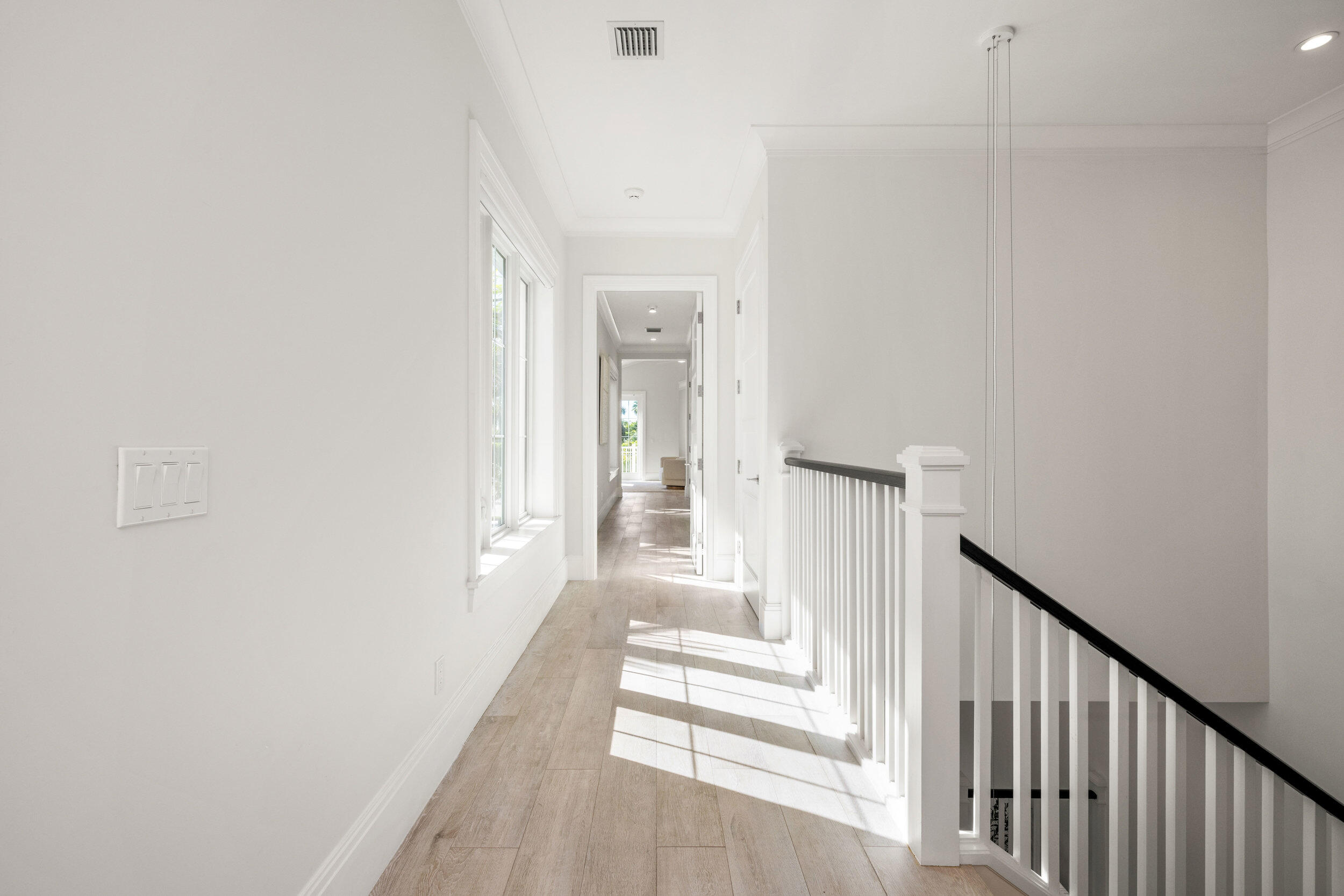 17 Adams Road Ocean Ridge, FL 33435 - Photo 13 of 41 a view of a hallway with wooden floor and staircase