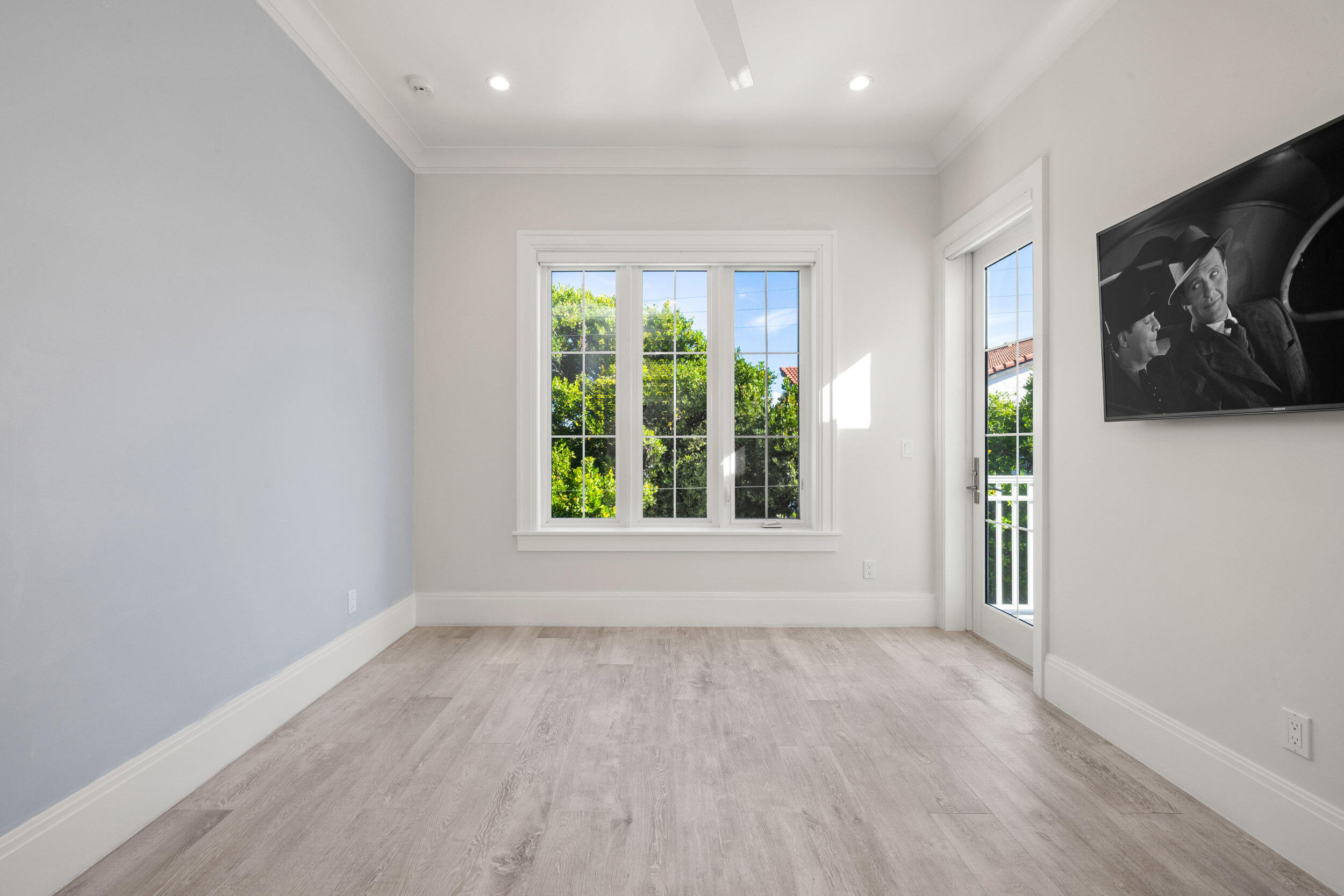 17 Adams Road Ocean Ridge, FL 33435 - Photo 24 of 41 a view of an empty room with wooden floor and a window
