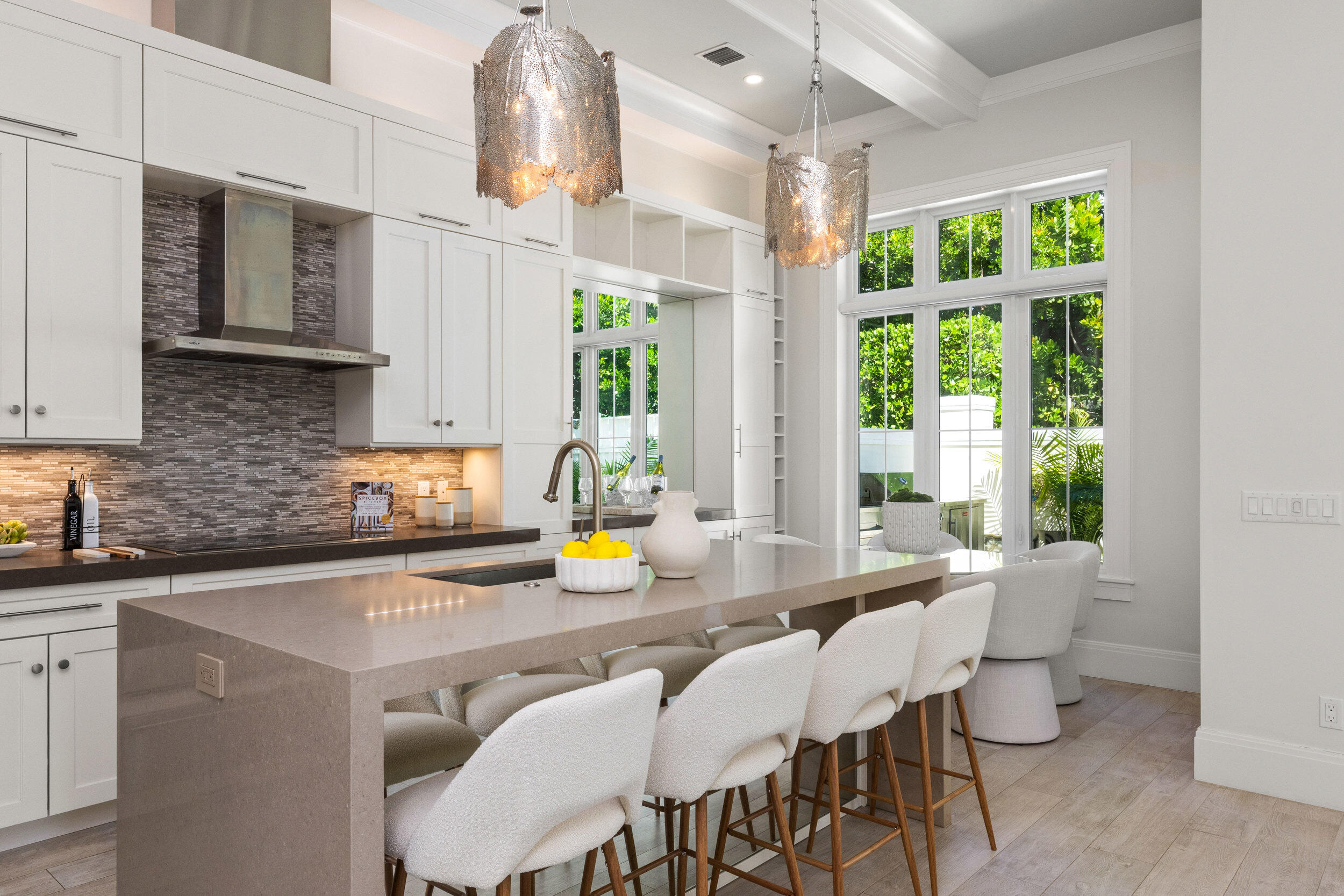 17 Adams Road Ocean Ridge, FL 33435 - Photo 8 of 41 a kitchen with a sink a window and chairs