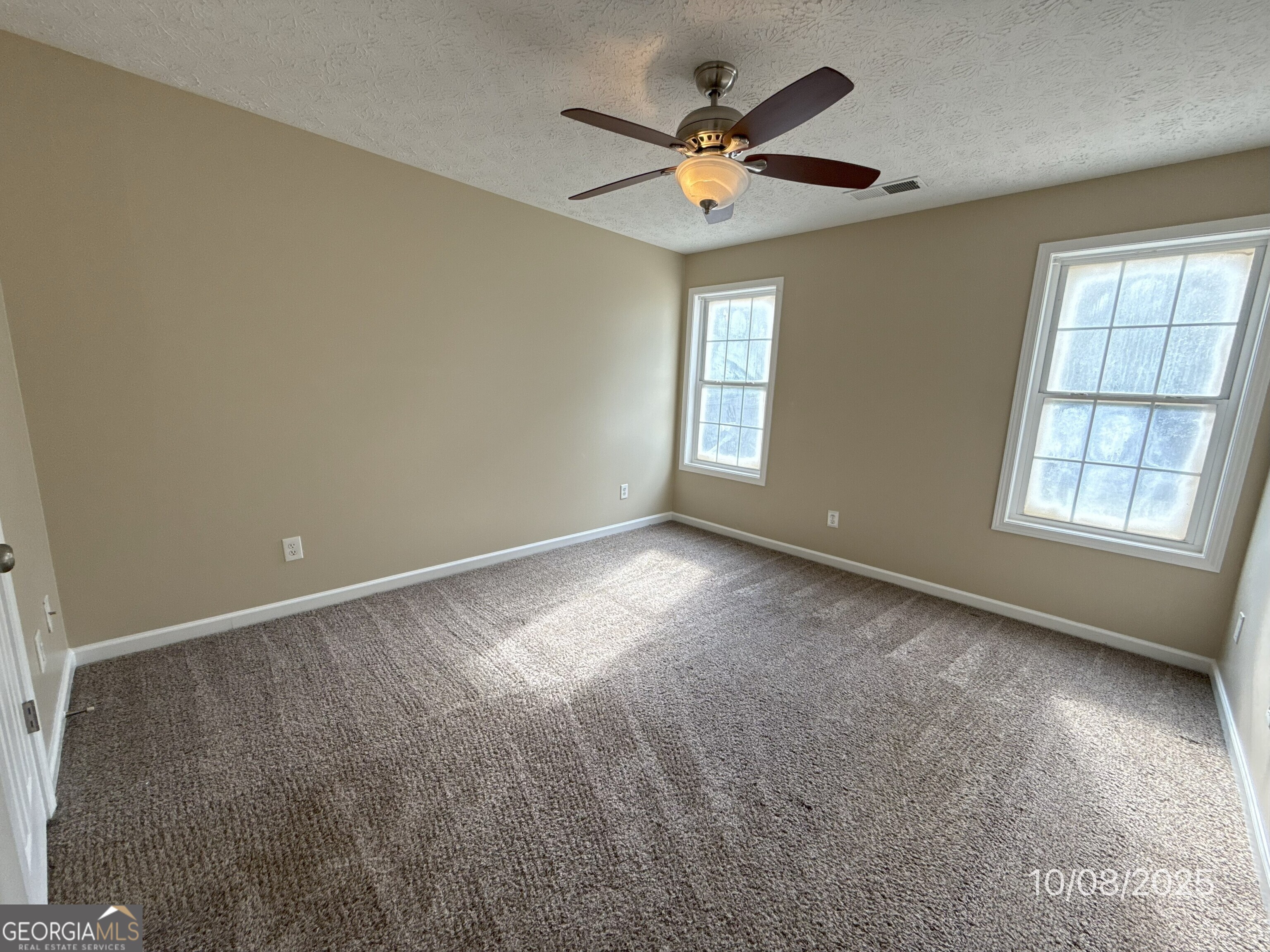 124 Waters Edge Drive Locust Grove, GA 30248 - Photo 8 of 13 an empty room with a window
