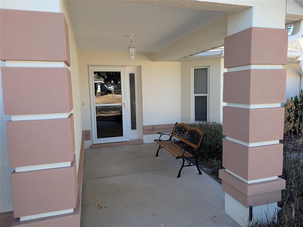 9573 Southwest 53rd Circle Ocala, FL 34476 - Photo 11 of 85 a living room with furniture and a chair