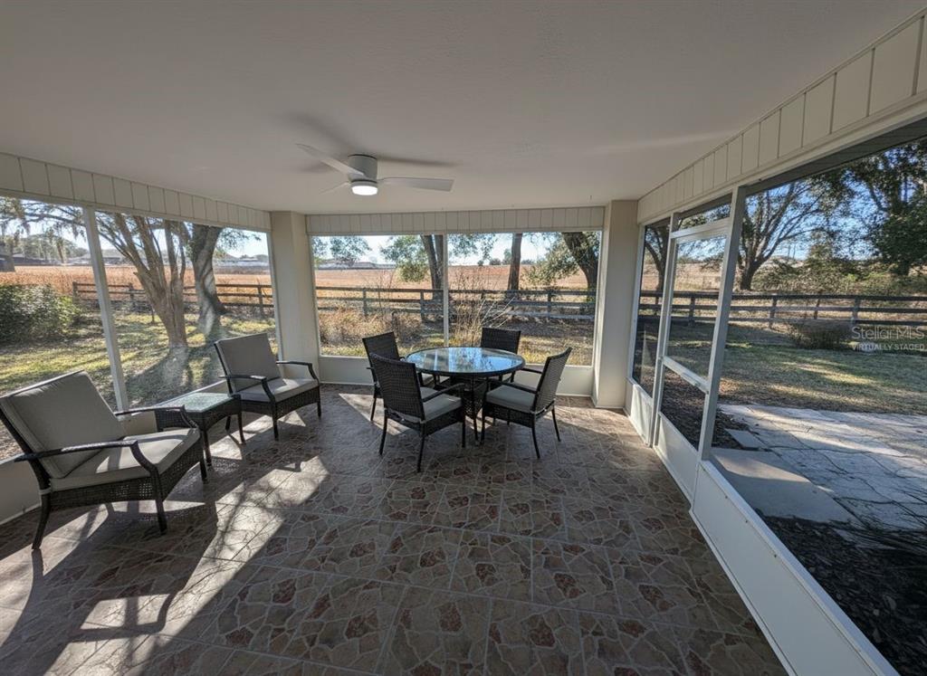 9573 Southwest 53rd Circle Ocala, FL 34476 - Photo 46 of 85 a view of a dining room with furniture wooden floor and outside view