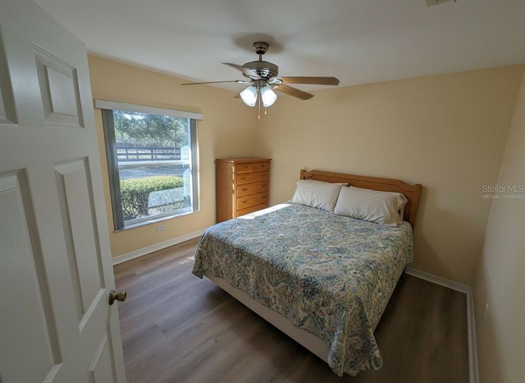 9573 Southwest 53rd Circle Ocala, FL 34476 - Photo 57 of 85 a bedroom with a bed and a window