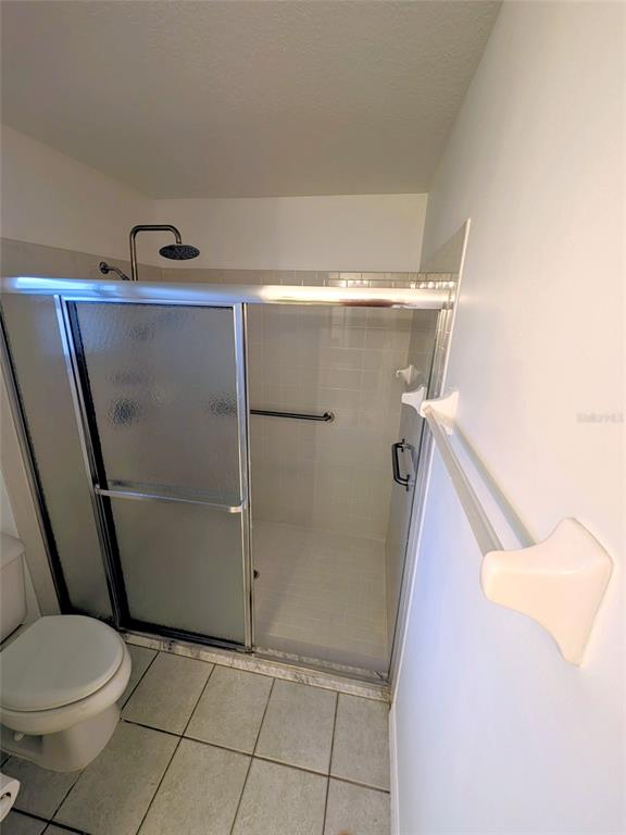 9573 Southwest 53rd Circle Ocala, FL 34476 - Photo 72 of 85 a bathroom with a toilet and a shower