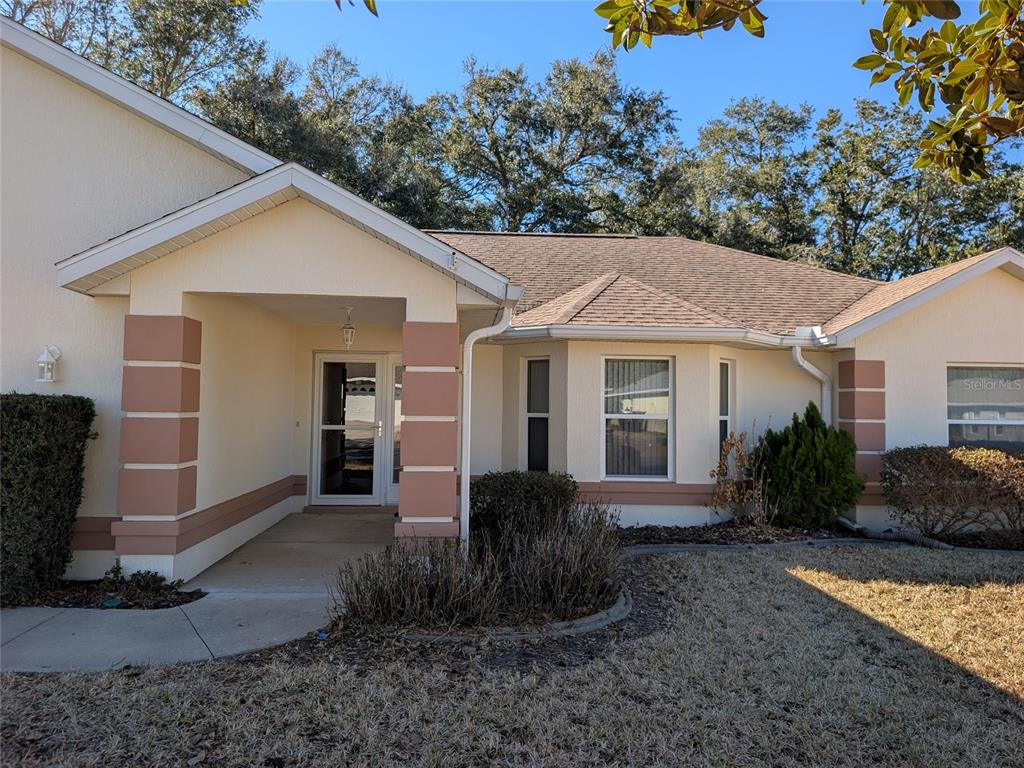 9573 Southwest 53rd Circle Ocala, FL 34476 - Photo 10 of 85 a view of a house with backyard and garden