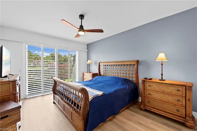 a bed room with a bed and a chair