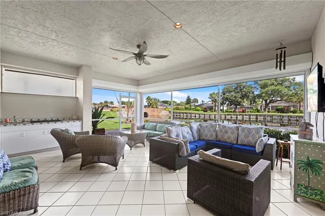 a living room with a couch and a window