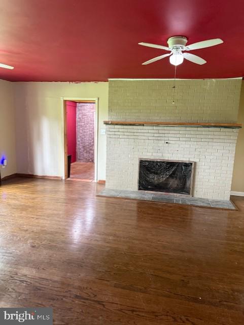 13342 Marsh Road Bealeton, VA 22712 - Photo 13 of 25 a view of an empty room with a fireplace and a ceiling fan