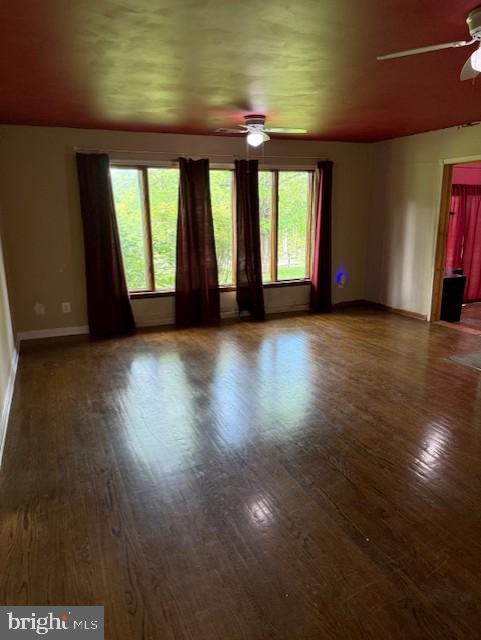 13342 Marsh Road Bealeton, VA 22712 - Photo 14 of 25 an empty room with wooden floor and windows