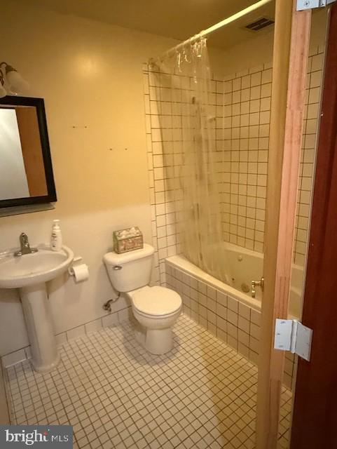 13342 Marsh Road Bealeton, VA 22712 - Photo 21 of 25 a bathroom with a toilet a sink and shower