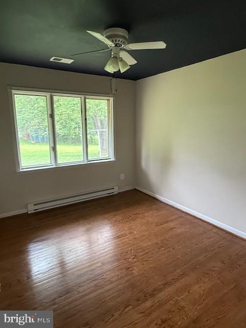 13342 Marsh Road Bealeton, VA 22712 - Photo 22 of 25 an empty room with wooden floor and windows