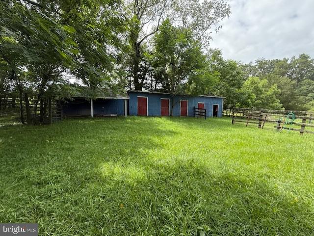 13342 Marsh Road Bealeton, VA 22712 - Photo 5 of 25 a view of a house with a yard and sitting area