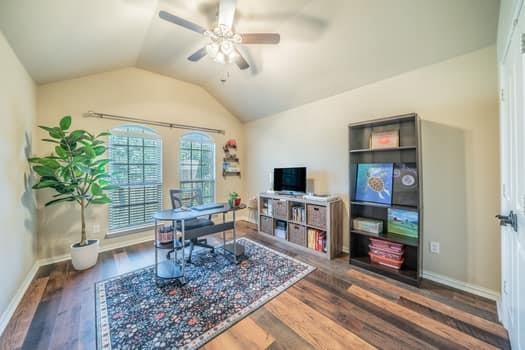 166 Oxford Ranch Road Waxahachie, TX 75167 - Photo 16 of 27 Vaulted ceiling with ceiling fan, wood-finish flooring, and arched windows with blinds, front outdoor view
