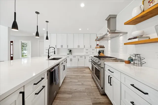 a bathroom with a double vanity sink mirror and