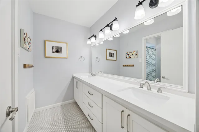 a view of a room with furniture and a window