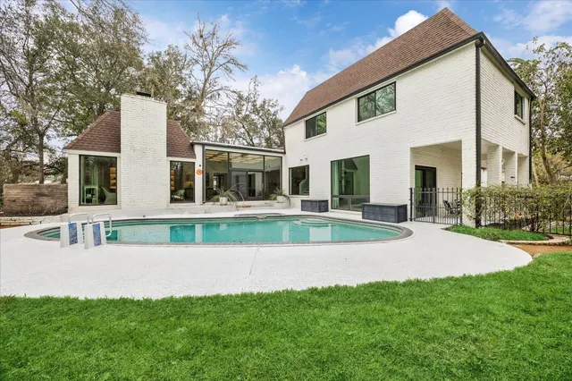 a view of swimming pool with a yard