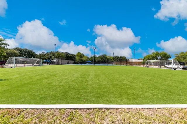 a view of a swimming pool with a patio