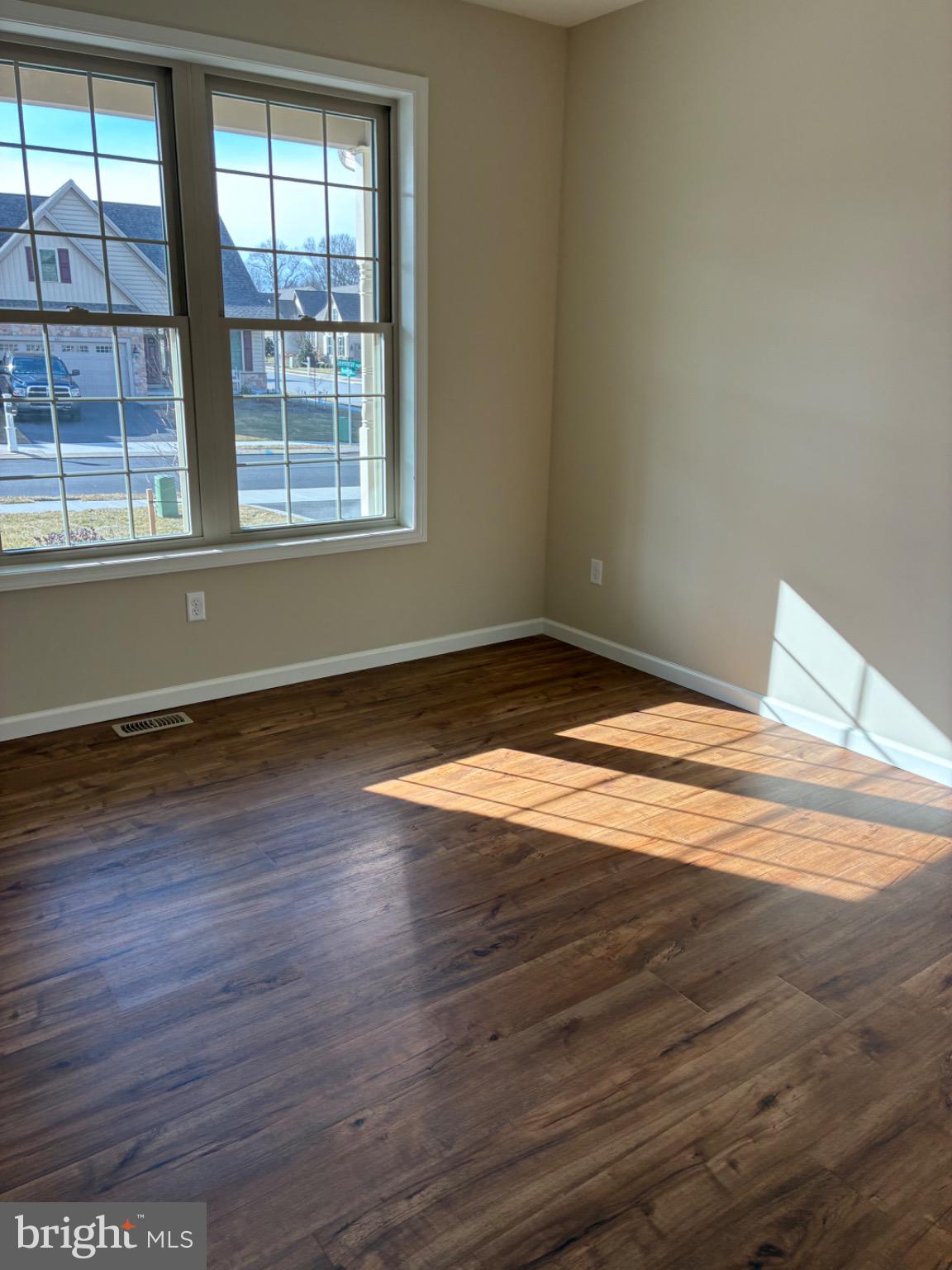 602 Greenbriar Path Cochranville, PA 19330 - Photo 14 of 20 a view of empty room with wooden floor and fan