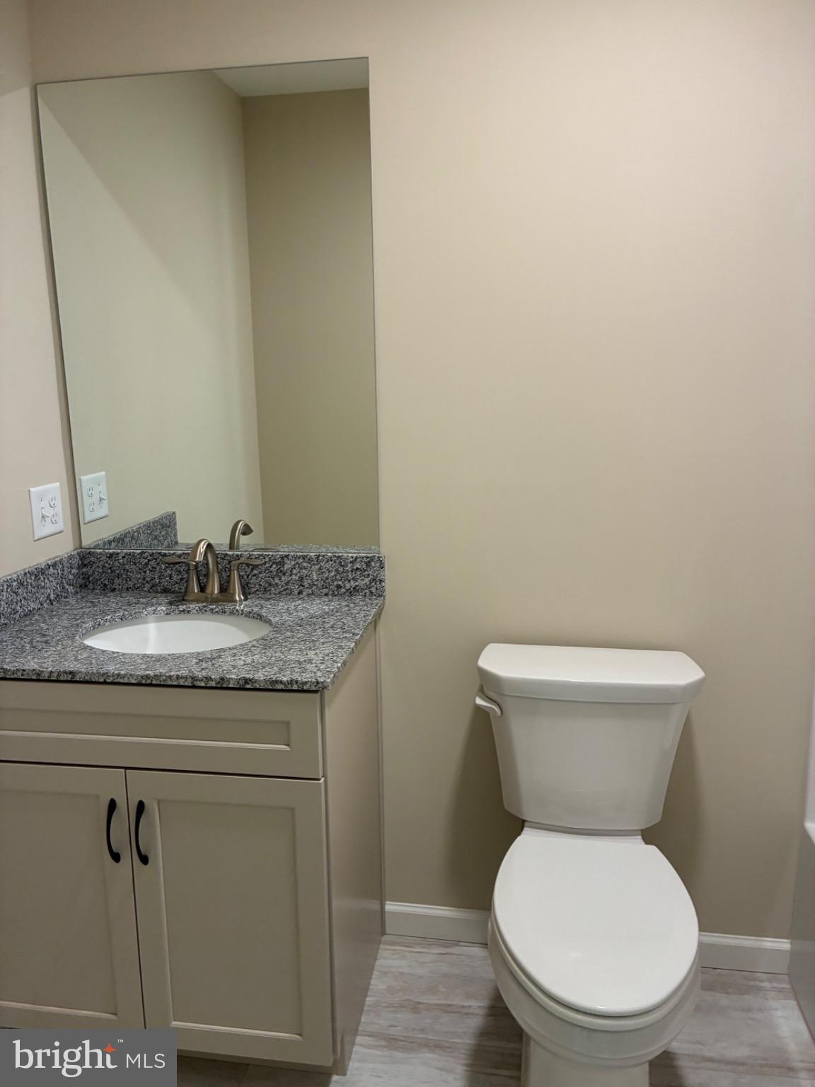 602 Greenbriar Path Cochranville, PA 19330 - Photo 18 of 20 a bathroom with a granite countertop toilet and a sink