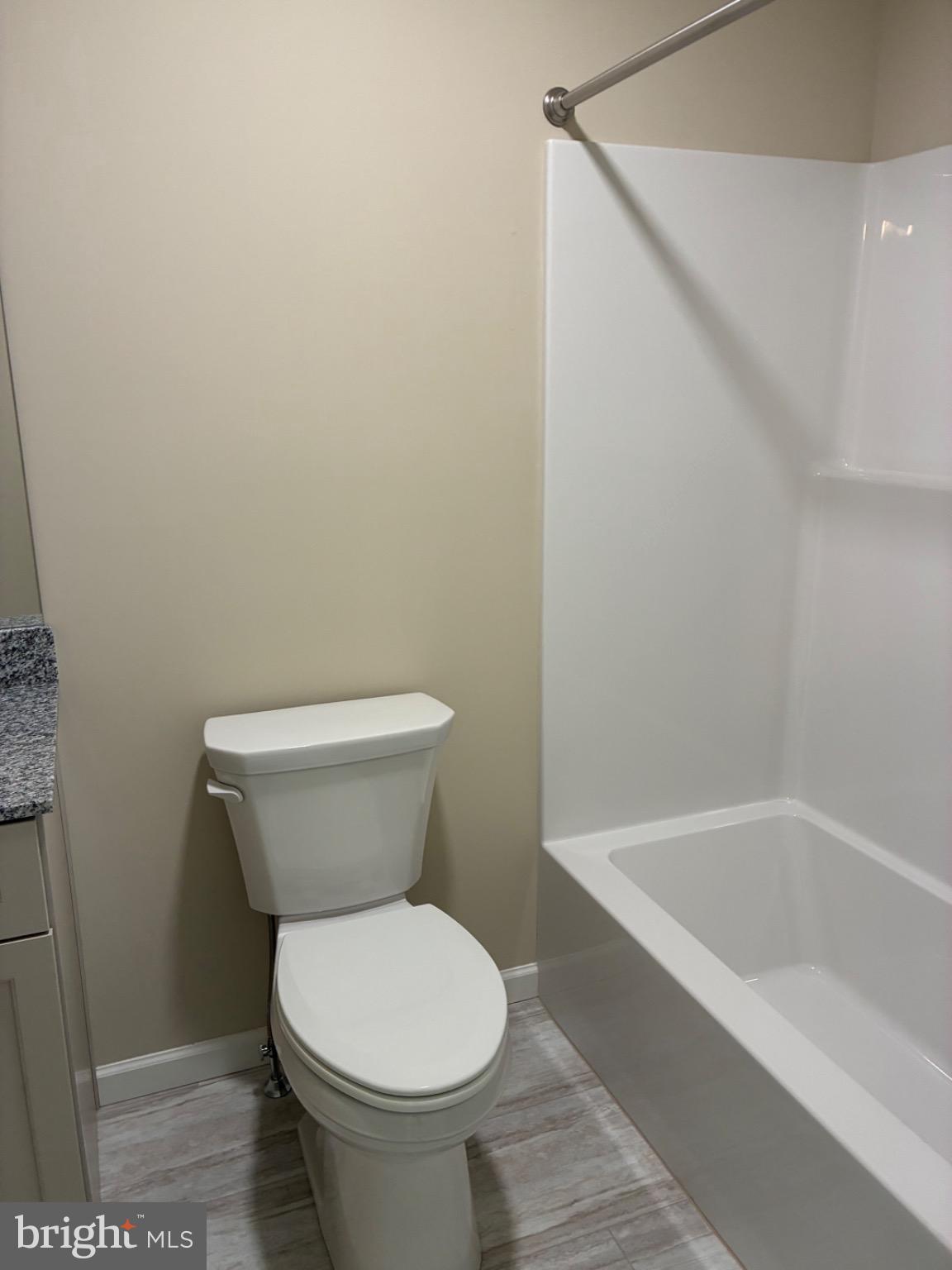 602 Greenbriar Path Cochranville, PA 19330 - Photo 19 of 20 a white toilet sitting next to a bath tub