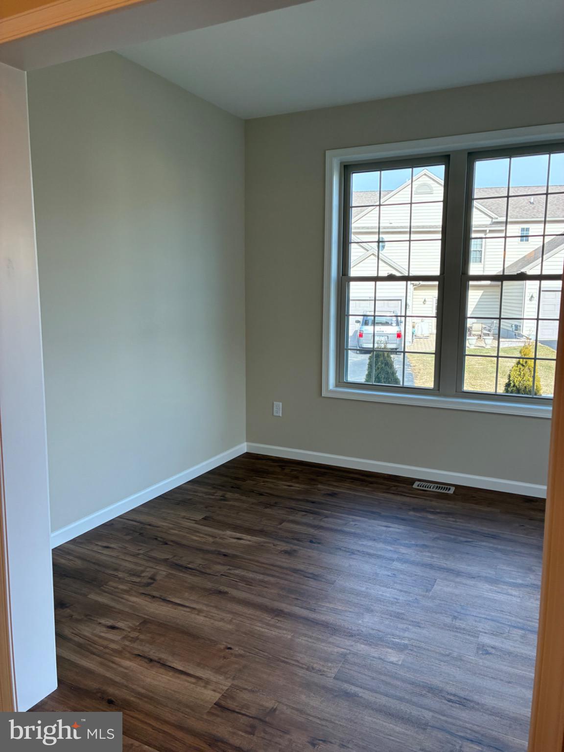 602 Greenbriar Path Cochranville, PA 19330 - Photo 6 of 20 wooden floor in an empty room with a window