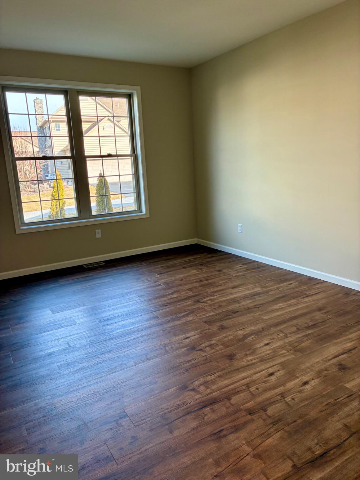 602 Greenbriar Path Cochranville, PA 19330 - Photo 9 of 20 an empty room with wooden floor and windows