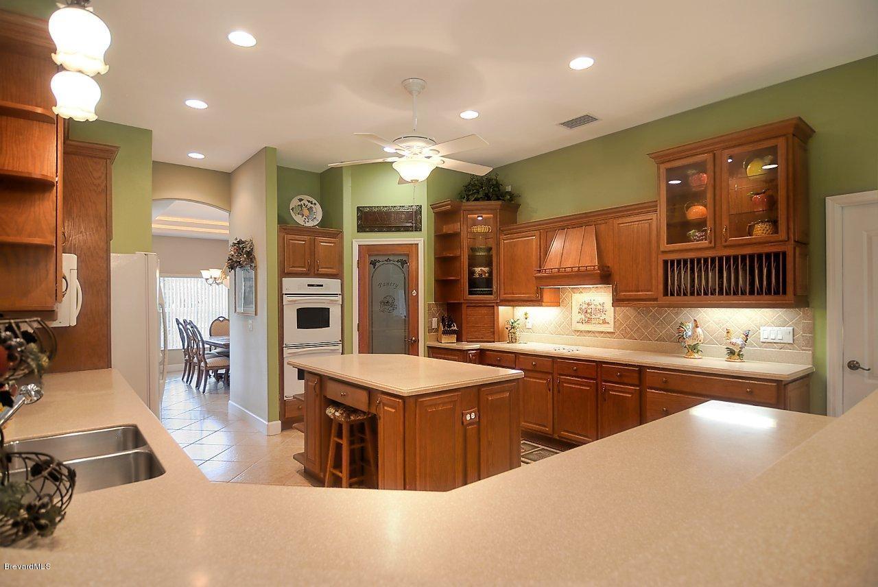 3199 Aurora Road Melbourne, FL 32934 - Photo 9 of 16 kitchen2 (2)