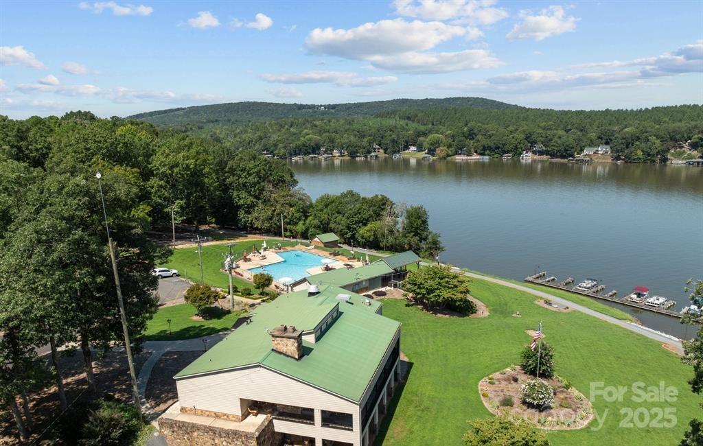 242 Creswell Road Mount Gilead, NC 27306 - Photo 13 of 20 a view of a lake with a mountain
