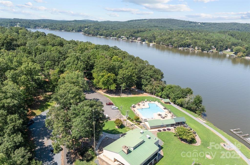 242 Creswell Road Mount Gilead, NC 27306 - Photo 16 of 20 an aerial view of lake residential house with outdoor space and trees around