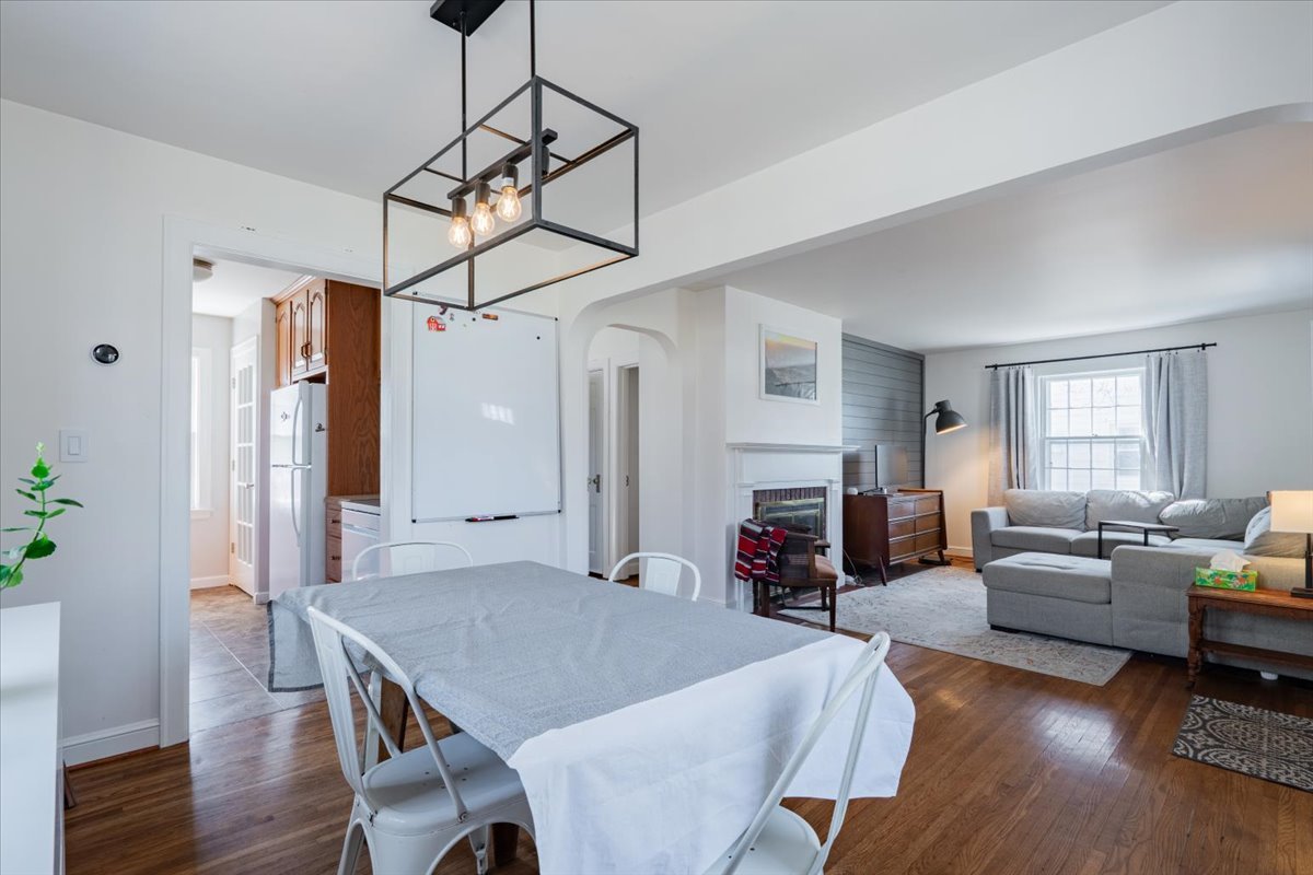 413 Grant Street Normal, IL 61761 - Photo 9 of 40 a view of a dining room and livingroom with furniture wooden floor a chandelier