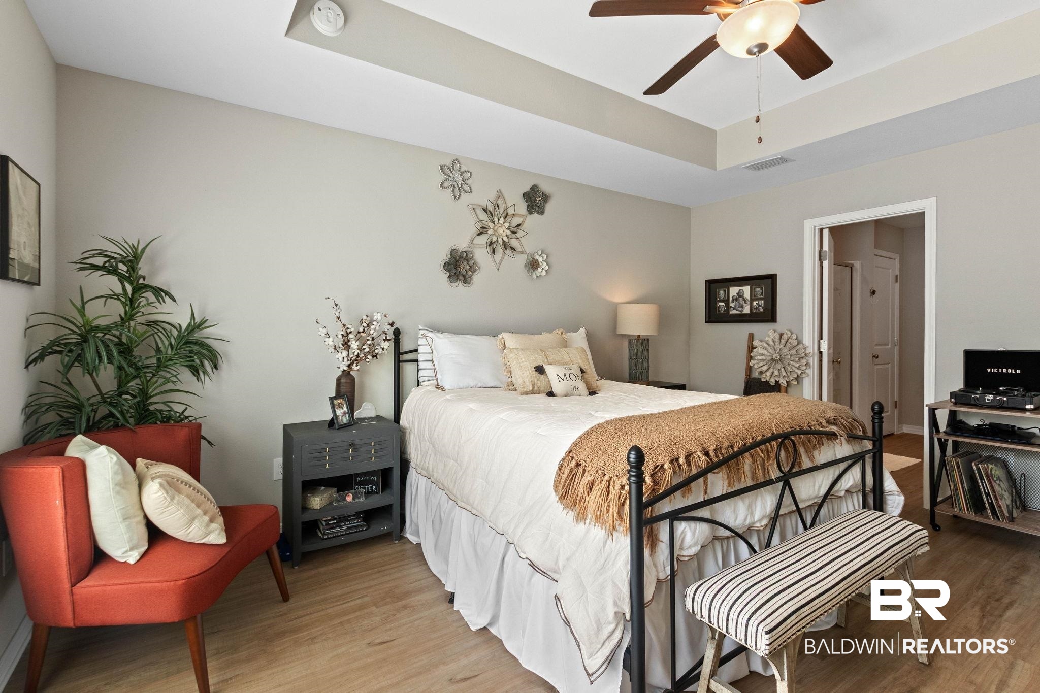 1203 Hayward Loop Foley, AL 36535 - Photo 16 of 41 Bedroom featuring a tray ceiling, light wood finished floors, and a ceiling fan