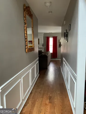 a view of gallery with wooden floor