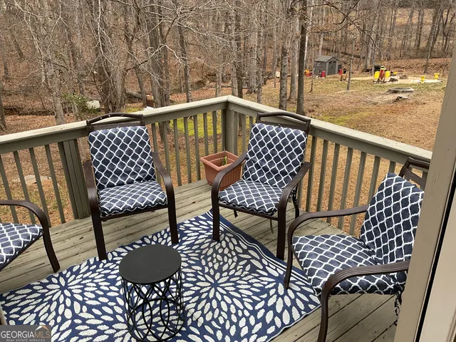 a view of balcony with wooden floor