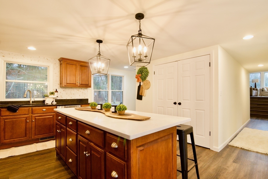 12 Rose Circle Hampden, MA 01036 - Photo 16 of 41 a kitchen with a sink a counter space and wooden floor