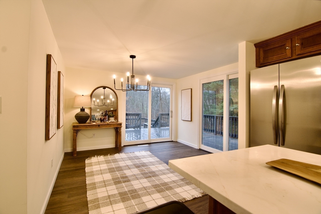 12 Rose Circle Hampden, MA 01036 - Photo 17 of 41 a bedroom with a bed a table and painting