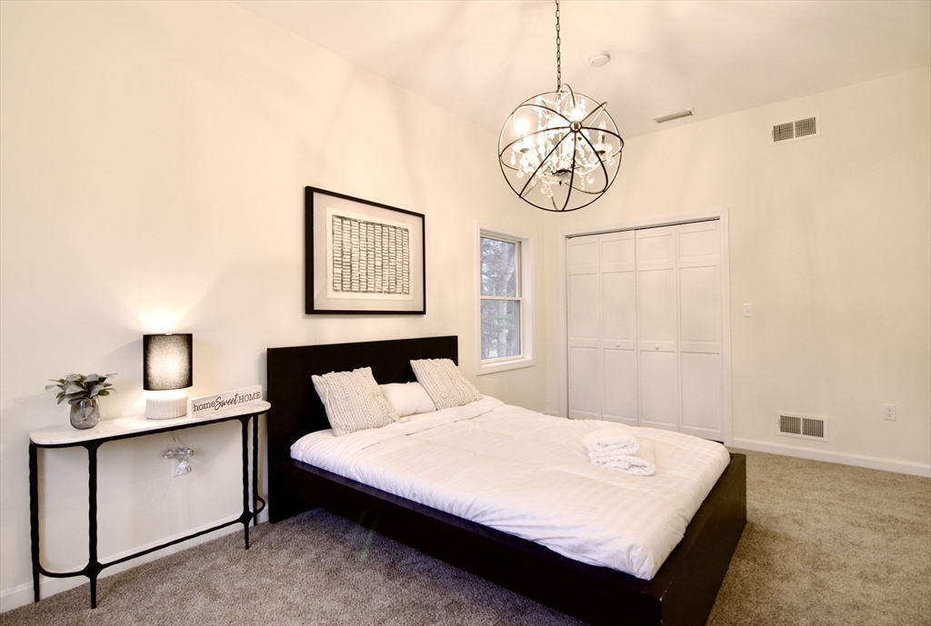 12 Rose Circle Hampden, MA 01036 - Photo 26 of 41 a bedroom with a bed and cabinets