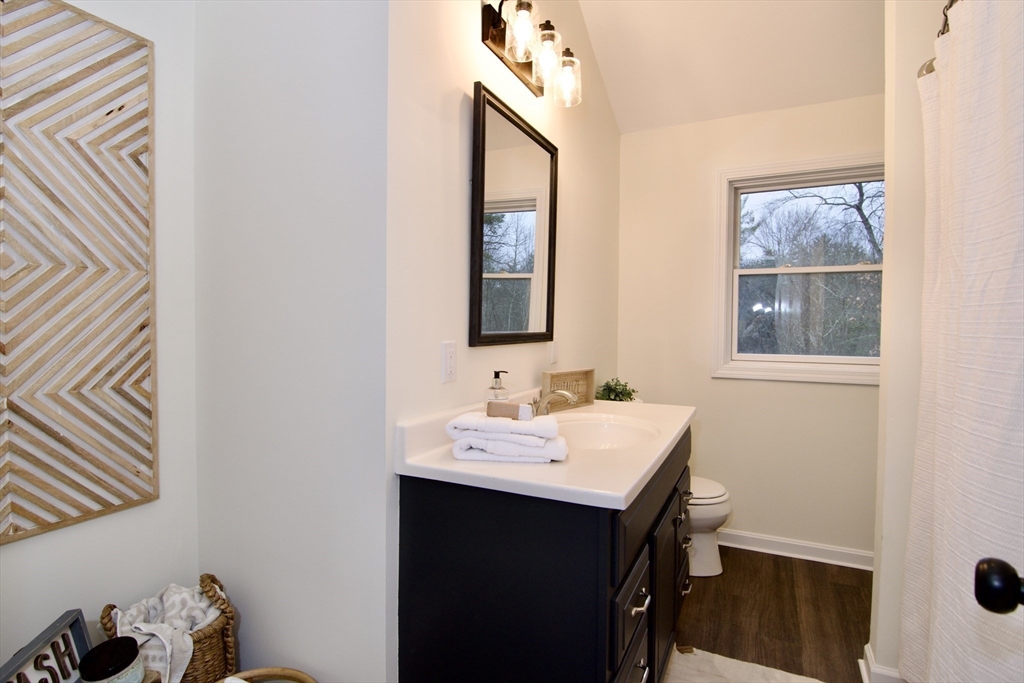 12 Rose Circle Hampden, MA 01036 - Photo 31 of 41 a bathroom with a sink and a mirror