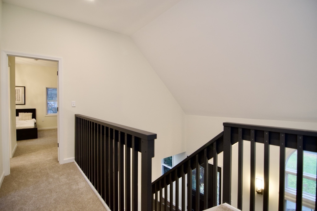 12 Rose Circle Hampden, MA 01036 - Photo 32 of 41 a view of a hallway with wooden floor and stairs