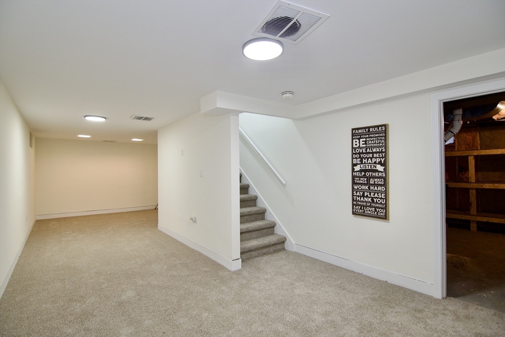12 Rose Circle Hampden, MA 01036 - Photo 37 of 41 an empty room with windows and stairs