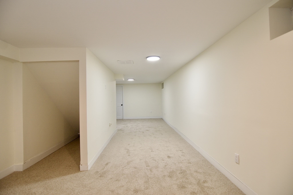 12 Rose Circle Hampden, MA 01036 - Photo 38 of 41 an empty room with a natural light