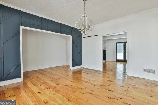 a view of a livingroom with a fireplace and window