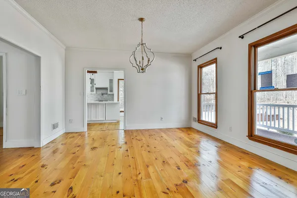 a living room with furniture a rug and a window