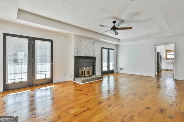 a kitchen with a stove a sink and a microwave
