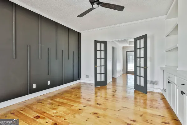a view of a living room with a large window