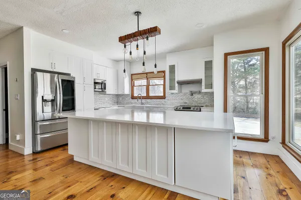 a spacious bathroom with a toilet and a shower