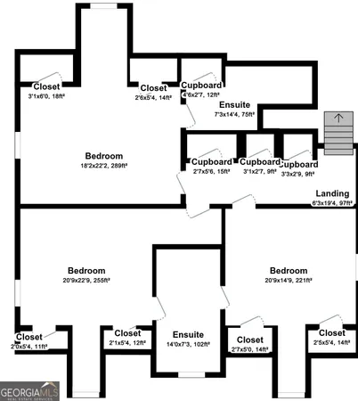 a view of a room with wooden floor and entryway